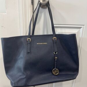 Michael Kors jet set navy blue tote with gold accents